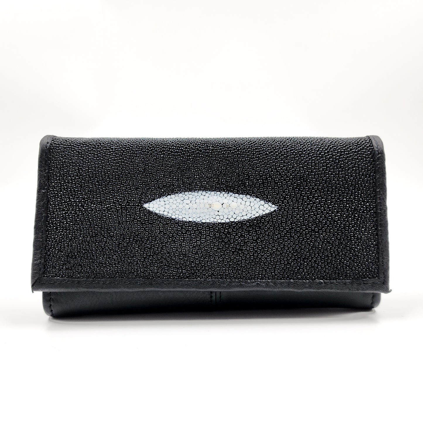 Central: Cartera Mantarraya (para ella).